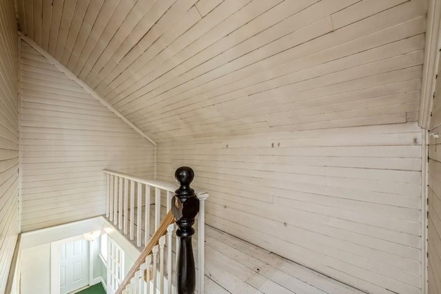 details with wooden walls and wood ceiling