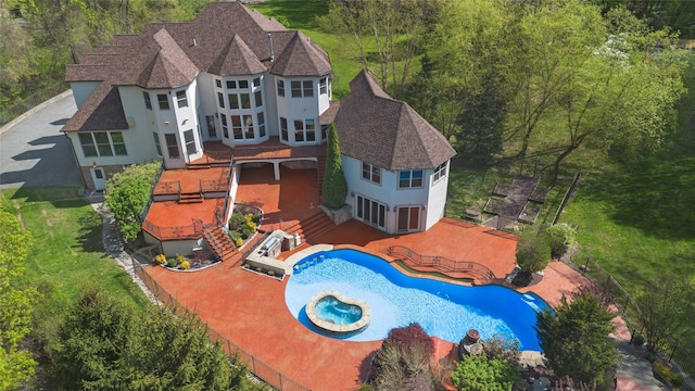 exterior space featuring a fenced backyard, an outdoor pool, stucco siding, and a wooden deck