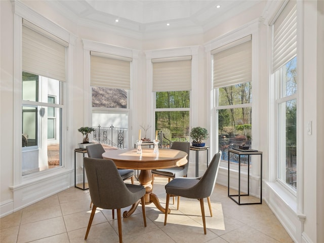 sunroom featuring recessed lighting, ornamental molding, tile patterned flooring, and a towering ceiling