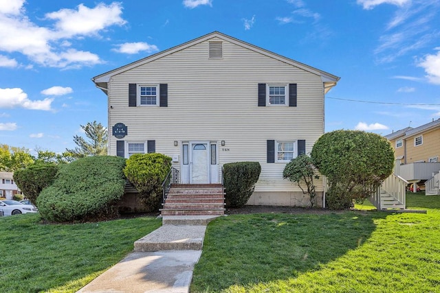 view of front of home featuring a front lawn