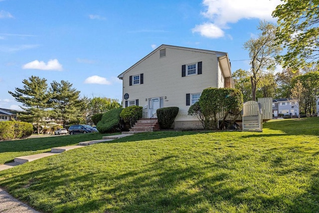 view of front of home with a front yard