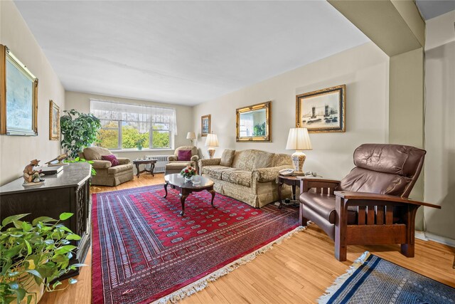 6300 Riverdale Ave Unit 5E, Bronx, NY 10471 - living room featuring radiator and wood finished floors