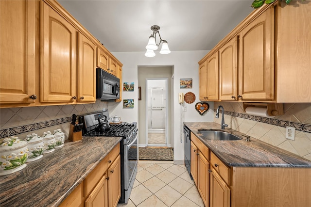 6300 Riverdale Ave Unit 5E, Bronx, NY 10471 - kitchen featuring a sink, dark stone countertops, backsplash, and black appliances