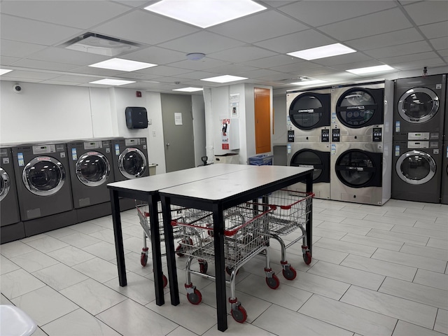 150 W 51 Unit 1032, New York Manhattan, NY 10019 - communal laundry room featuring stacked washing machine and dryer, separate washer and dryer, and light tile patterned floors