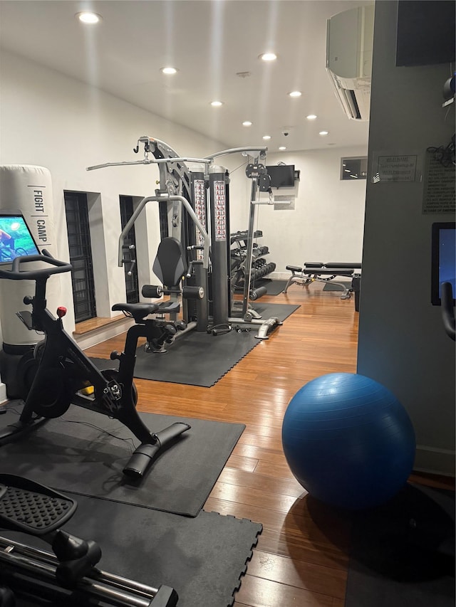 150 W 51 Unit 1032, New York Manhattan, NY 10019 - exercise room featuring wood-type flooring and recessed lighting