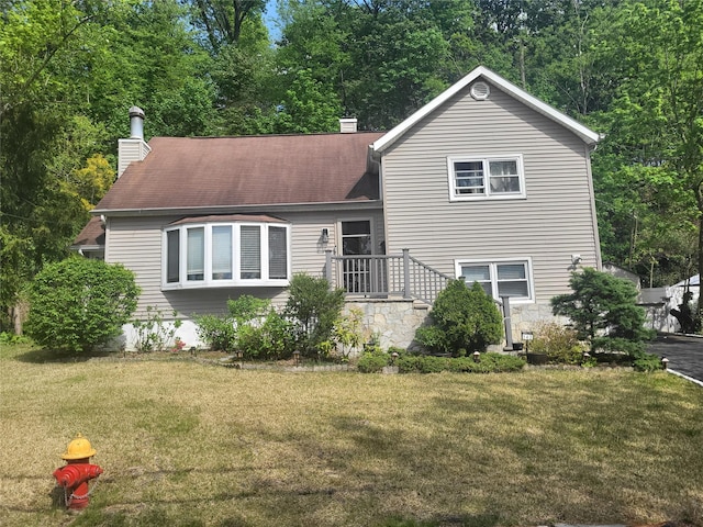 142 Pembrook Dr, Yonkers, NY 10710 - split level home featuring a front lawn and a chimney