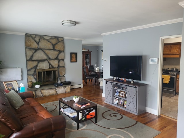 142 Pembrook Dr, Yonkers, NY 10710 - living room with a baseboard radiator, baseboards, a stone fireplace, crown molding, and wood finished floors