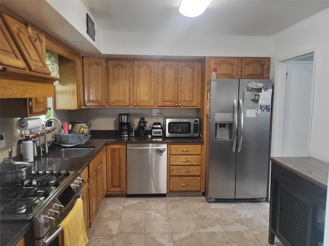 142 Pembrook Dr, Yonkers, NY 10710 - kitchen with brown cabinets, decorative backsplash, appliances with stainless steel finishes, and a sink