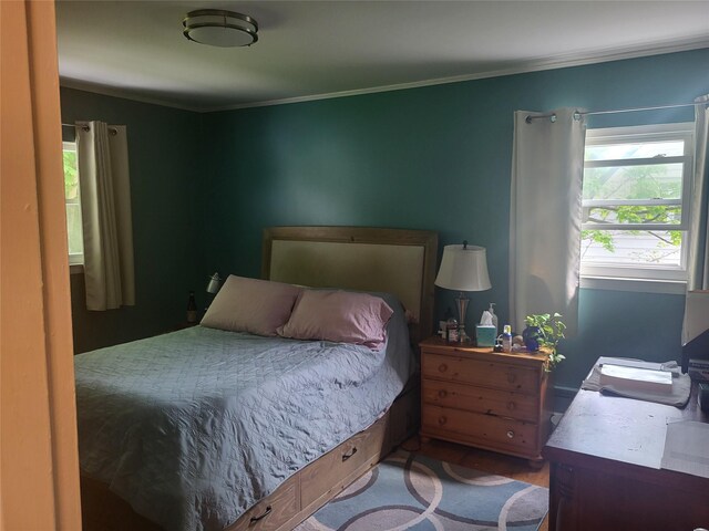 142 Pembrook Dr, Yonkers, NY 10710 - bedroom with multiple windows, crown molding, and wood finished floors