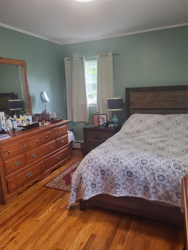 142 Pembrook Dr, Yonkers, NY 10710 - bedroom featuring a baseboard radiator, ornamental molding, and wood finished floors