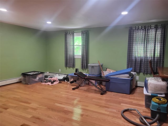 142 Pembrook Dr, Yonkers, NY 10710 - miscellaneous room with wood finished floors, baseboard heating, a baseboard radiator, and recessed lighting