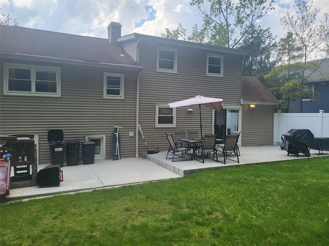 142 Pembrook Dr, Yonkers, NY 10710 - rear view of property featuring a lawn, a chimney, a patio area, and fence