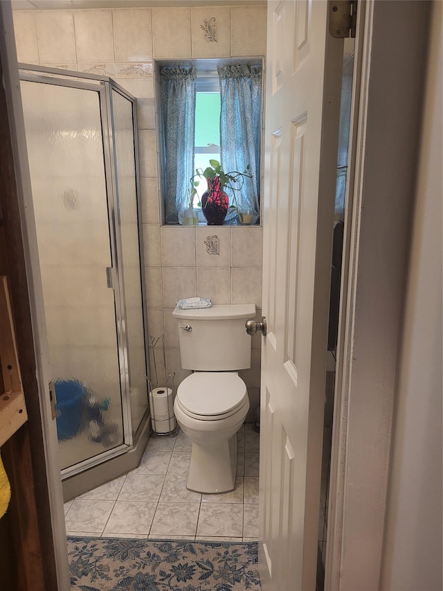142 Pembrook Dr, Yonkers, NY 10710 - full bathroom with a stall shower, tile walls, tile patterned flooring, and toilet
