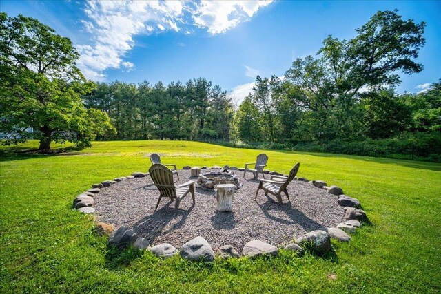 view of yard with a fire pit