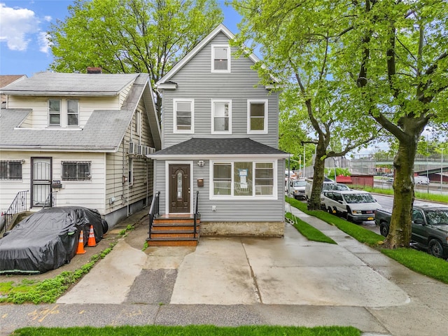 61-12 160th St, Fresh Meadows, NY 11365 - view of front facade featuring entry steps and a shingled roof