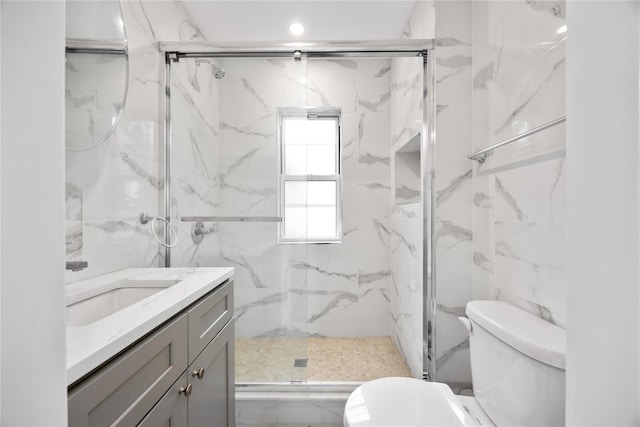 61-12 160th St, Fresh Meadows, NY 11365 - bathroom featuring toilet, a marble finish shower, vanity, tile walls, and recessed lighting