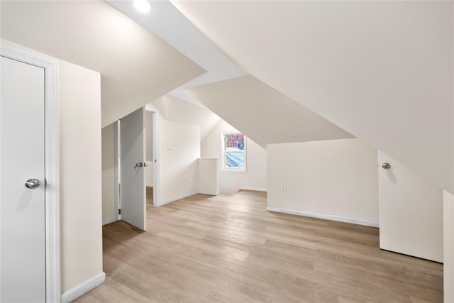 61-12 160th St, Fresh Meadows, NY 11365 - bonus room featuring light wood-style flooring, baseboards, and vaulted ceiling