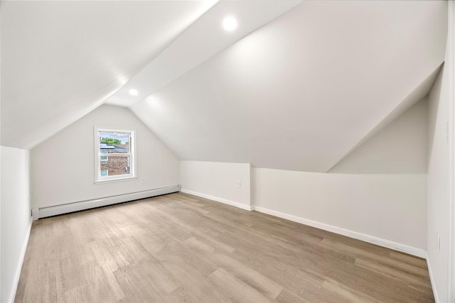 61-12 160th St, Fresh Meadows, NY 11365 - additional living space with baseboard heating, vaulted ceiling, wood finished floors, baseboards, and recessed lighting