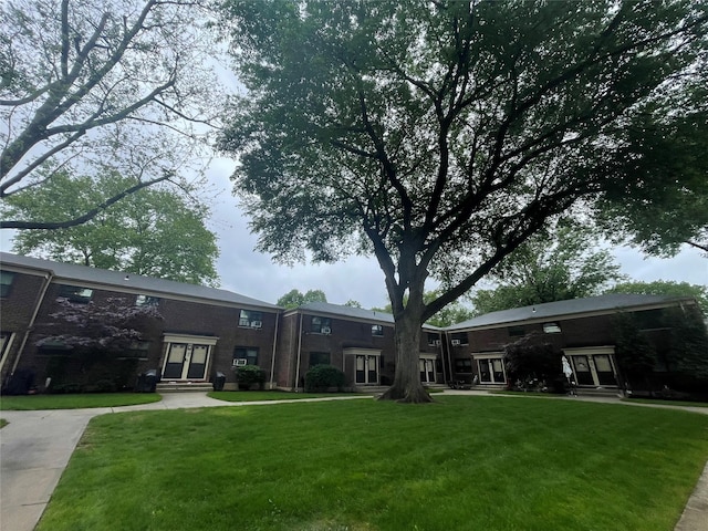 22048 75th Ave Unit A1, Bayside, NY 11364 - view of grassy yard featuring entry steps and french doors