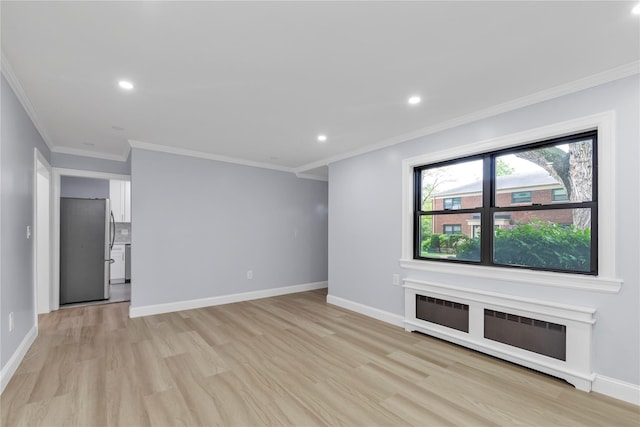 22048 75th Ave Unit A1, Bayside, NY 11364 - unfurnished living room with light wood-style flooring, baseboards, recessed lighting, ornamental molding, and radiator heating unit