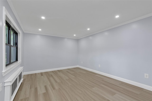 22048 75th Ave Unit A1, Bayside, NY 11364 - spare room featuring light wood-style floors, baseboards, recessed lighting, and crown molding