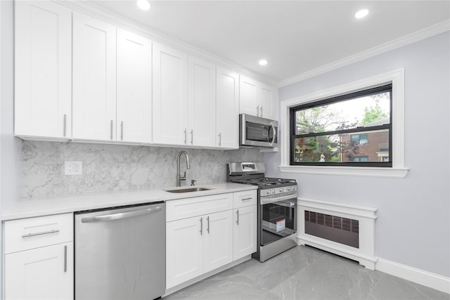 22048 75th Ave Unit A1, Bayside, NY 11364 - kitchen with stainless steel appliances, a sink, light marble finish floors, light countertops, and crown molding