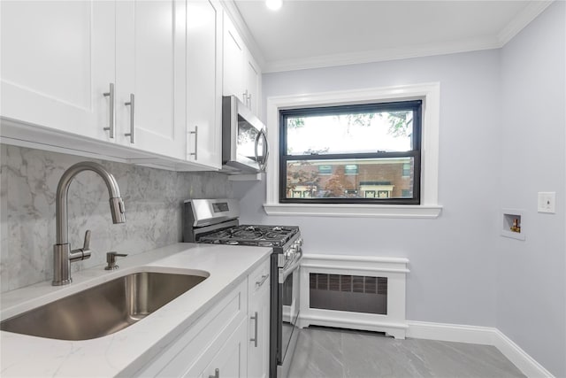 22048 75th Ave Unit A1, Bayside, NY 11364 - kitchen with stainless steel appliances, a sink, decorative backsplash, light stone countertops, and white cabinets