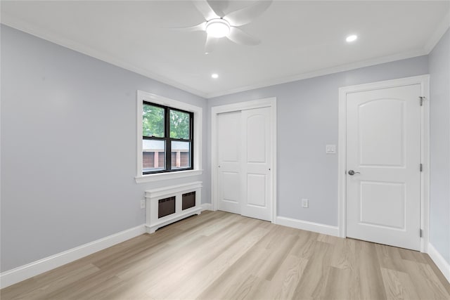 22048 75th Ave Unit A1, Bayside, NY 11364 - unfurnished bedroom with light wood finished floors, crown molding, a closet, baseboards, and recessed lighting