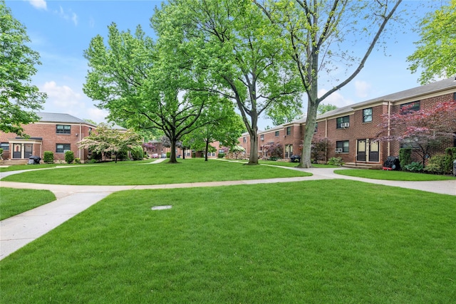 22048 75th Ave Unit A1, Bayside, NY 11364 - view of community featuring a yard and a residential view