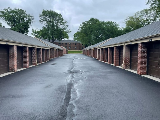 22048 75th Ave Unit A1, Bayside, NY 11364 - view of asphalt road with community garages