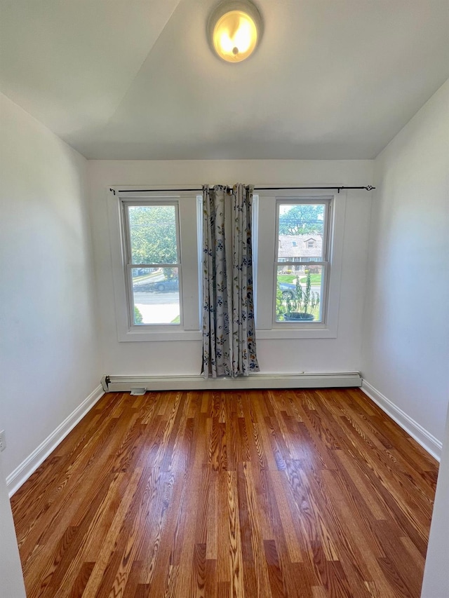 58 7th St, Valley Stream, NY 11581 - unfurnished room with wood finished floors and baseboards