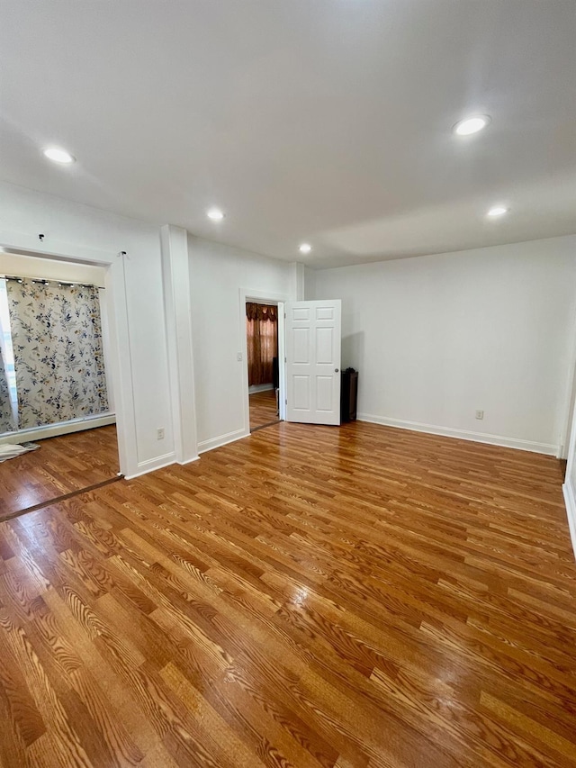58 7th St, Valley Stream, NY 11581 - below grade area with wood finished floors and recessed lighting