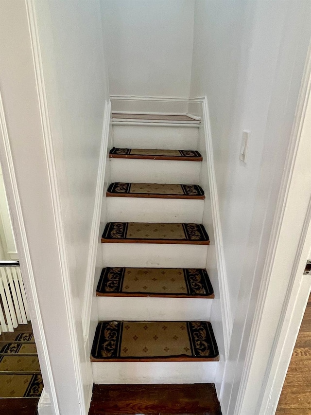 58 7th St, Valley Stream, NY 11581 - stairs featuring wood finished floors