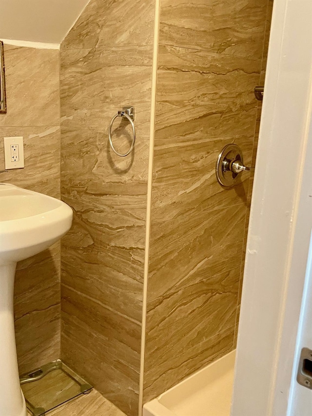 58 7th St, Valley Stream, NY 11581 - bathroom featuring a shower stall and tile walls