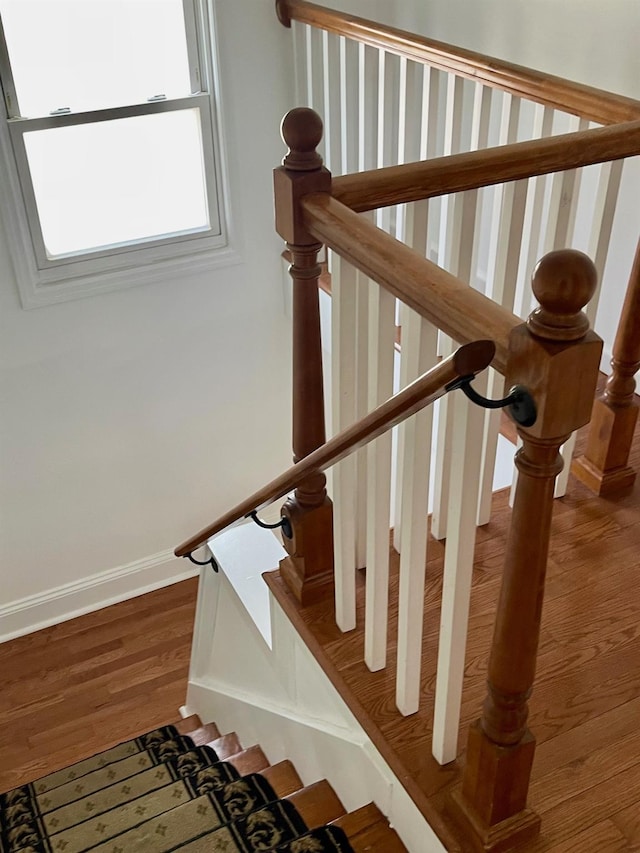58 7th St, Valley Stream, NY 11581 - stairs featuring wood finished floors and baseboards
