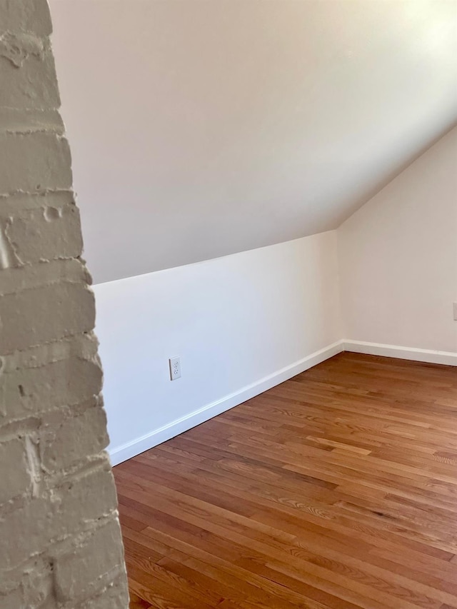 58 7th St, Valley Stream, NY 11581 - additional living space featuring lofted ceiling and wood finished floors