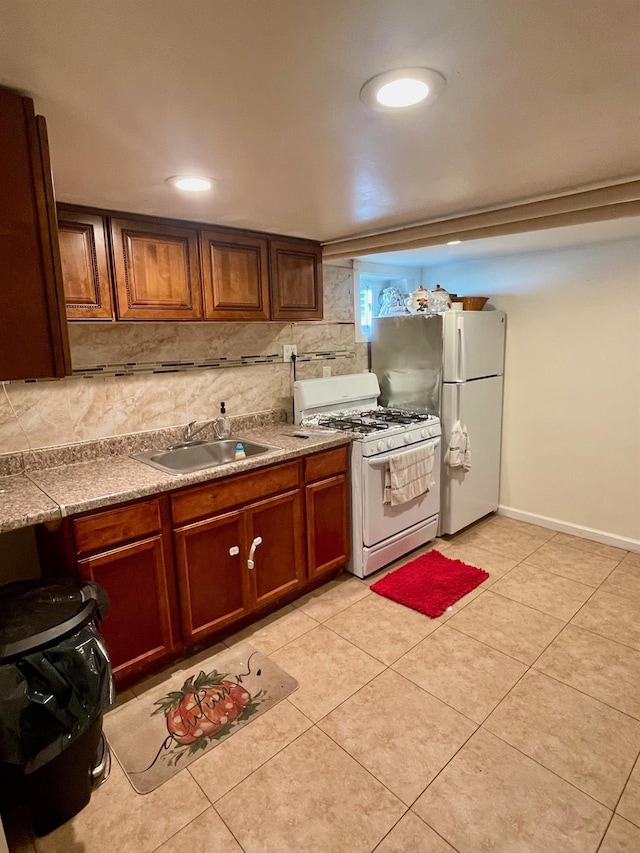 58 7th St, Valley Stream, NY 11581 - kitchen featuring white appliances, light tile patterned floors, brown cabinets, light countertops, and backsplash
