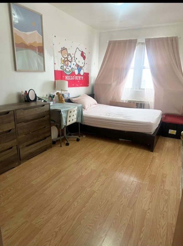 bedroom featuring light wood-style floors