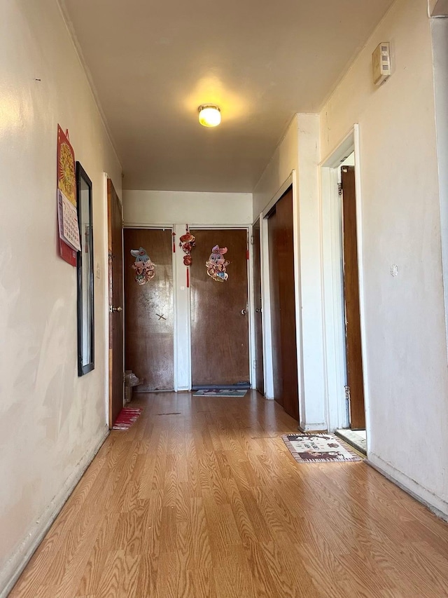 hall with wood finished floors