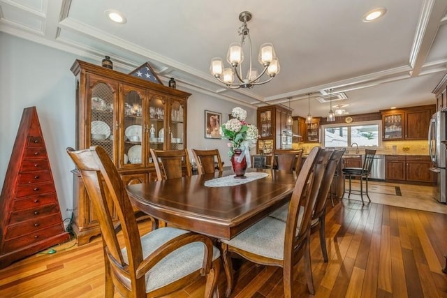 708 Seabury Ave, Franklin Square, NY 11010 - dining area featuring an inviting chandelier, ornamental molding, light wood finished floors, and recessed lighting