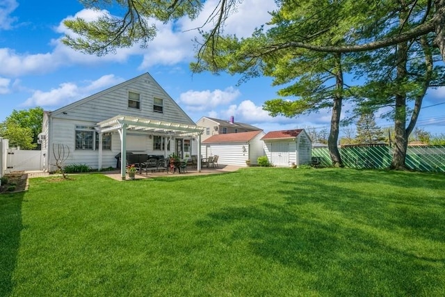 708 Seabury Ave, Franklin Square, NY 11010 - rear view of property featuring a pergola, a gate, a patio area, a storage shed, and a yard