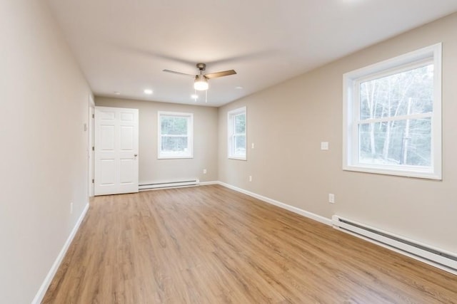 435 State Route 55, Eldred, NY 12732 - spare room with baseboards, a ceiling fan, light wood finished floors, and a baseboard heating unit