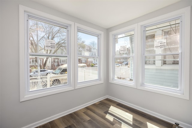 unfurnished sunroom featuring a wealth of natural light