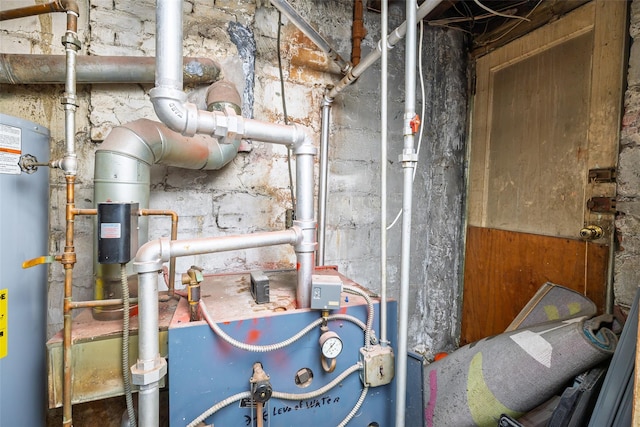 utility room featuring gas water heater