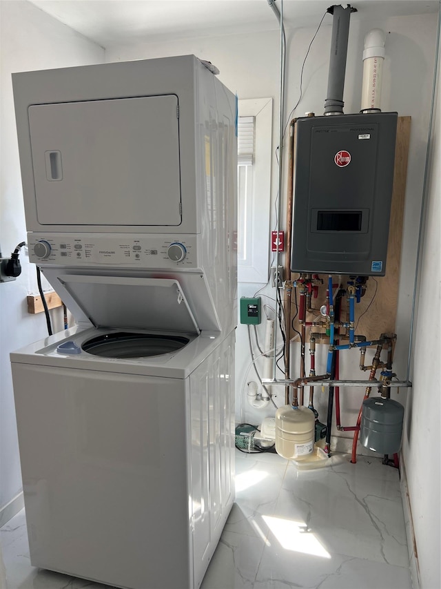washroom featuring laundry area, stacked washer and clothes dryer, marble finish floor, and water heater