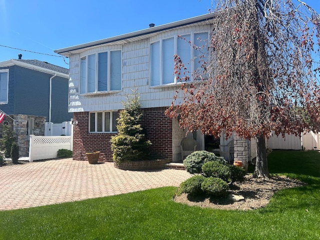 163-20 88th St, Howard Beach, NY 11414 - rear view of house featuring brick siding and a patio area