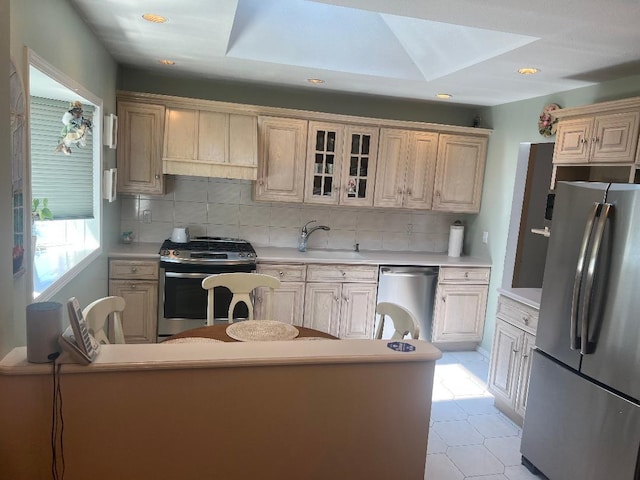 163-20 88th St, Howard Beach, NY 11414 - kitchen featuring stainless steel appliances, a sink, light countertops, tasteful backsplash, and recessed lighting