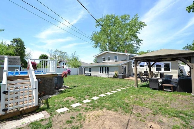 127 W Court Dr, Centereach, NY 11720 - view of green lawn featuring a gazebo, a storage unit, an outbuilding, and an outdoor living space