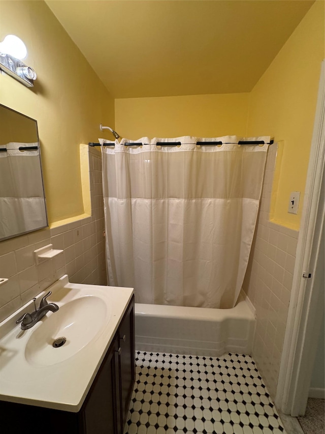 91 Tulip Ave Unit C2, Floral Park, NY 11001 - bathroom with tile walls, wainscoting, shower / bath combo, vanity, and tile patterned floors
