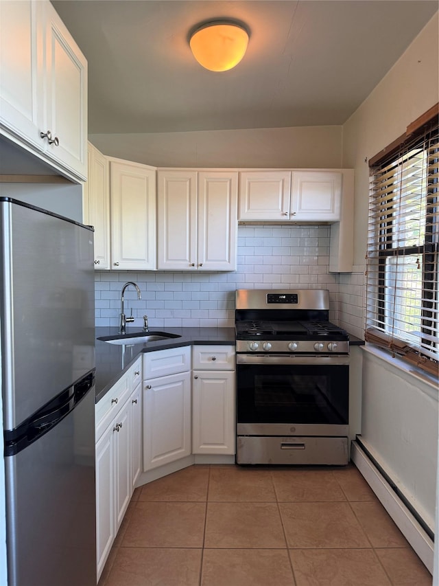 91 Tulip Ave Unit C2, Floral Park, NY 11001 - kitchen with a sink, tasteful backsplash, baseboard heating, and stainless steel appliances